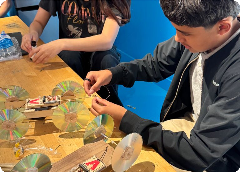 Students assemble and test a classroom project.